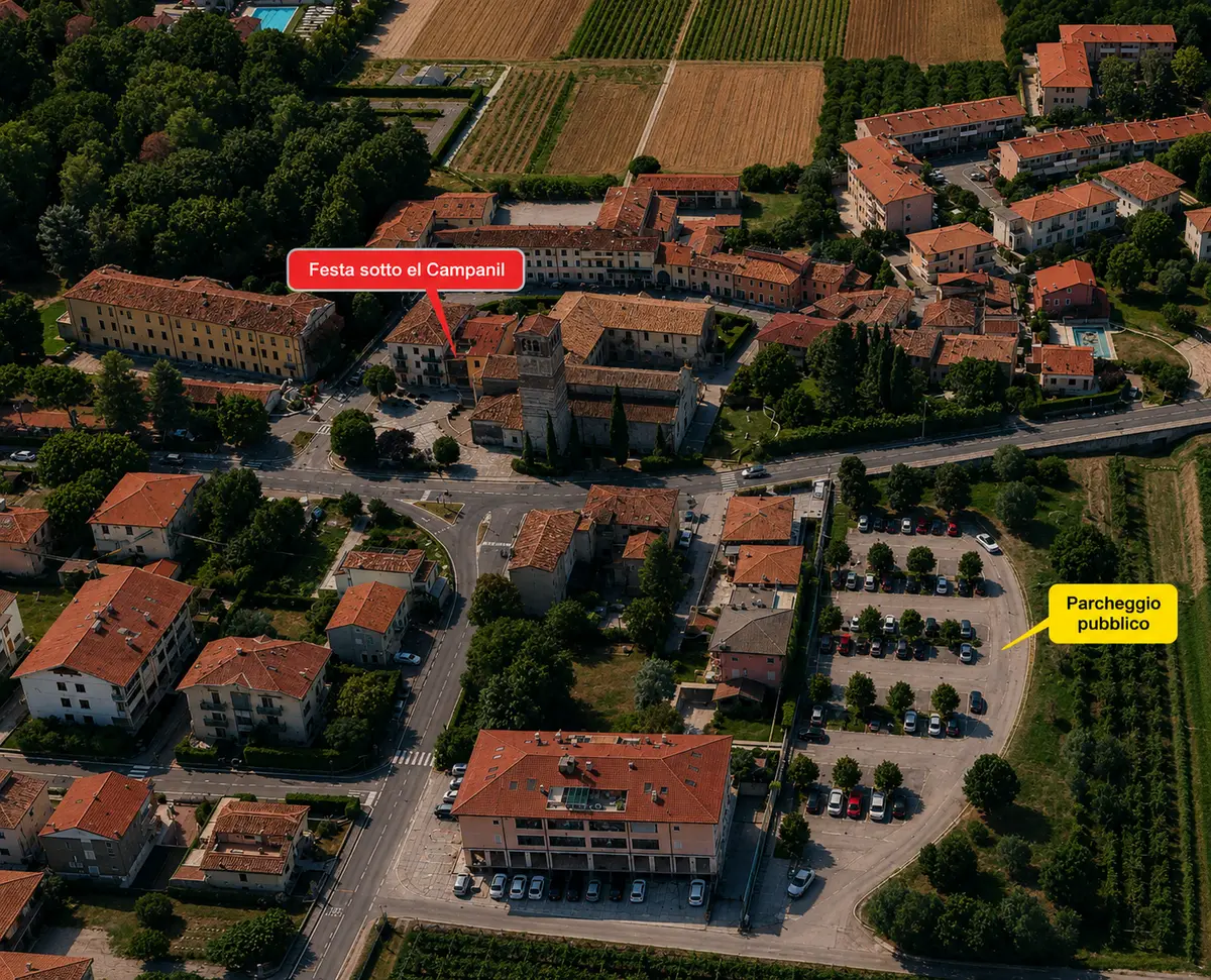 Vista aerea di San Floriano con la festa sotto el Campanil e, poco più a sud, il parcheggio pubblico